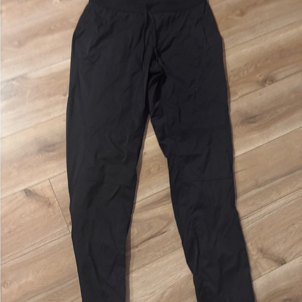 The North Face Black Track Pants with Elastic Waistband and Tapered Leg